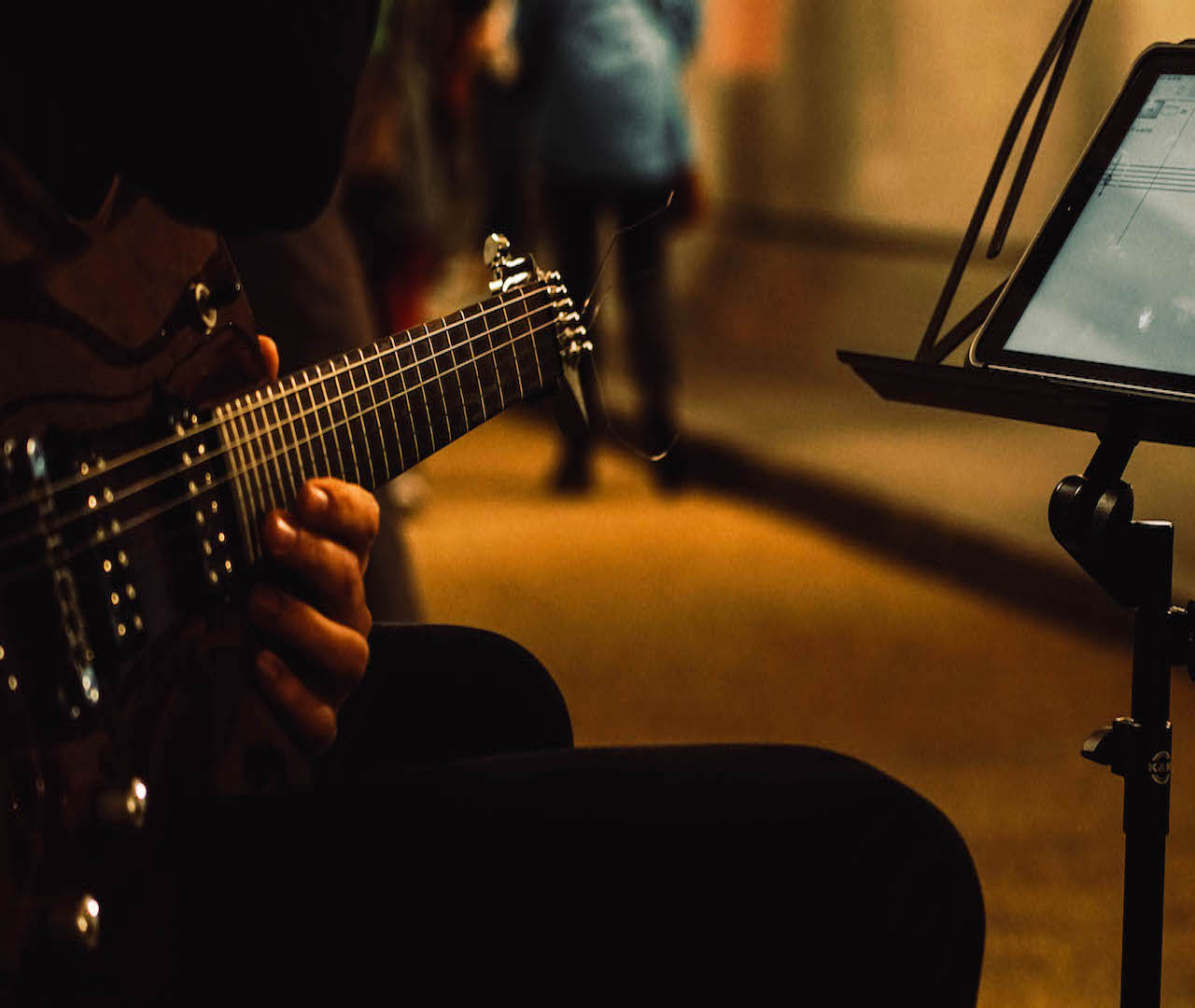 Open Fields - Guitarist reading iPad score